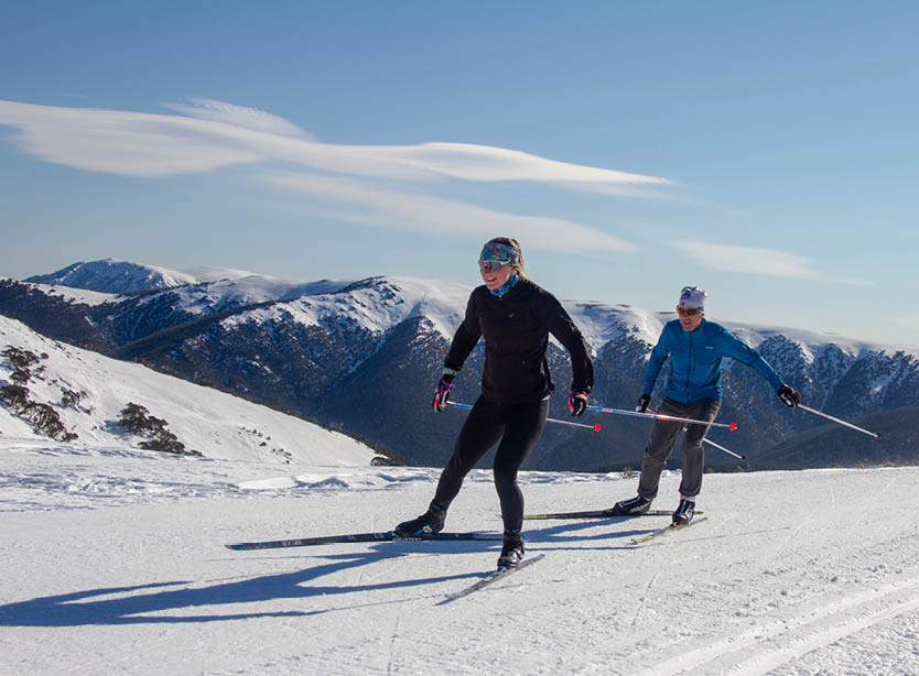 Skate skiiing with Mt Bogong in the background at Fall Creek Cross Country
